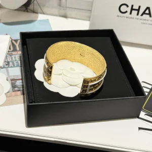 Chanel White CC Gold Cuff Bracelets